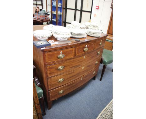 A VICTORIAN MAHOGANY BOW FRONTED CHEST of three short and three long drawers with brass handles and bracket feet, 114cm wide