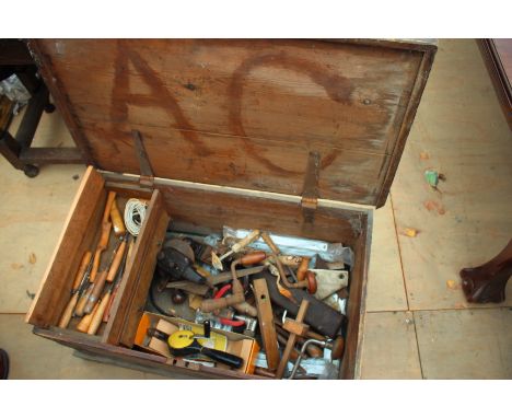 AN OLD TOOL CHEST with various chisels and tools, 82cm wide