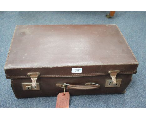 AN OLD SUITCASE containing a number of watch makers parts and tools, wire etc.