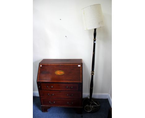 A CHINOISERIE DECORATED BLACK LACQUERED LAMP STANDARD, 152cm high together with an Edwardian mahogany bureau with shell decor