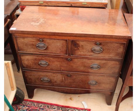 A VICTORIAN MAHOGANY CHEST of two short and two long drawers standing on bracket feet, 85cm wide