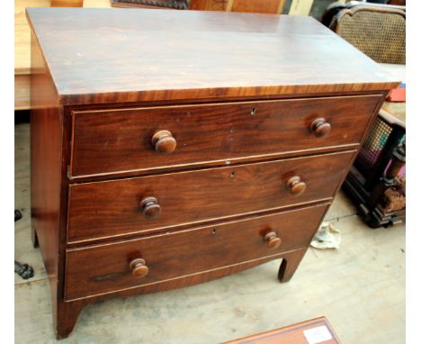 A VICTORIAN MAHOGANY CHEST of three long drawers with turned knob handles and bracket feet, 95cm wide