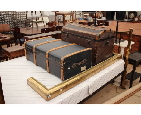 A VICTORIAN BRASS FENDER together with an old domed topped travelling trunk and a further trunk (3)