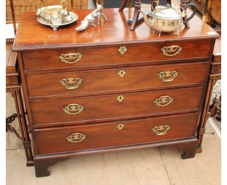 A GEORGE III MAHOGANY CHEST of four long drawers, later swan neck handles and standing on bracket feet 95cm wide x 80.5cm hig