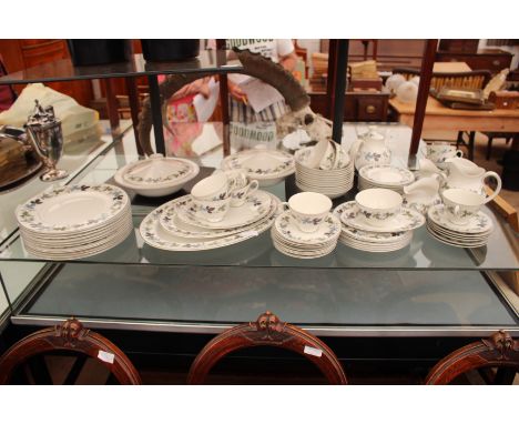 A ROYAL DOULTON BURGUNDY PATTERN PART DINNER SERVICE with dinner plates, dessert plates, bowls, saucers, tea plates, a teapot