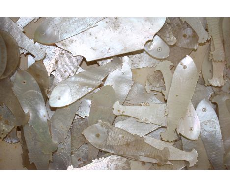 A QUANTITY OF CHINESE MOTHER OF PEARL GAMING COUNTERS in the form of fish, approximately 60 in total