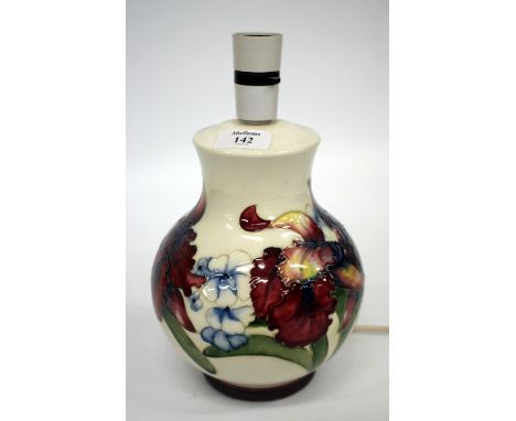 A MOORCROFT TABLE LAMP the cream ground decorated with various flowers 21cm high