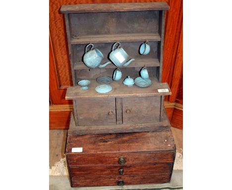 A MINIATURE PINE DRESSER, the plate rack above two cupboard doors below, 39cm wide together with a 19th century mahogany tabl
