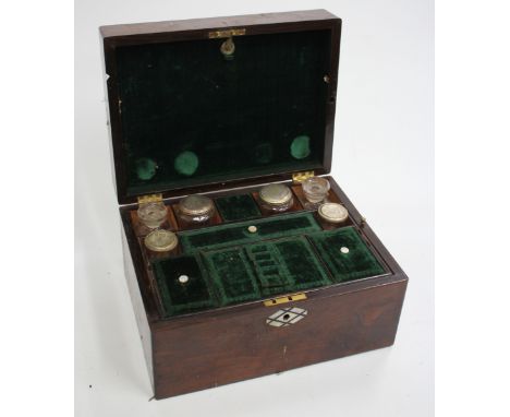 A VICTORIAN ROSEWOOD LADIES DRESSING BOX, the fitted interior with bottles and jars with a drawer to the side, the lid and es