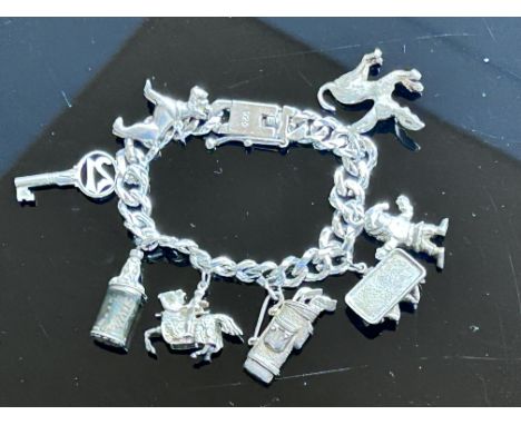 Silver charm bracelet 68.8g - 8 charms 