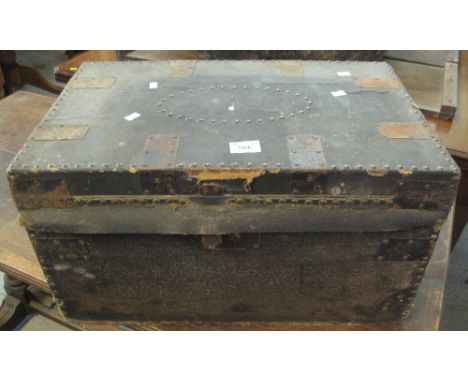 Small metal banded travelling trunk with metal loop carrying handles.