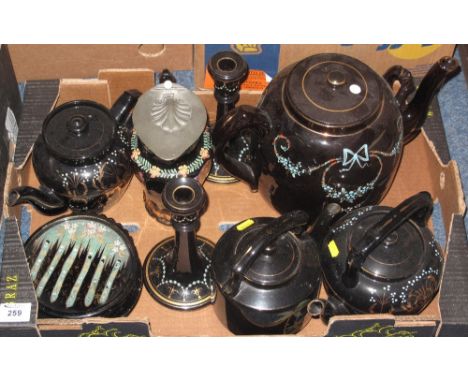 Tray of Victorian black ground items with painted enamel decoration comprising: teapots; water jugs; teapot stand; candlestic