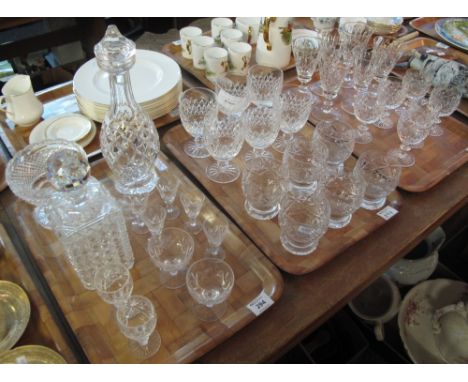 Three trays of glassware to include: Waterford crystal decanter and stopper; square section, hob nail cut decanter and stoppe