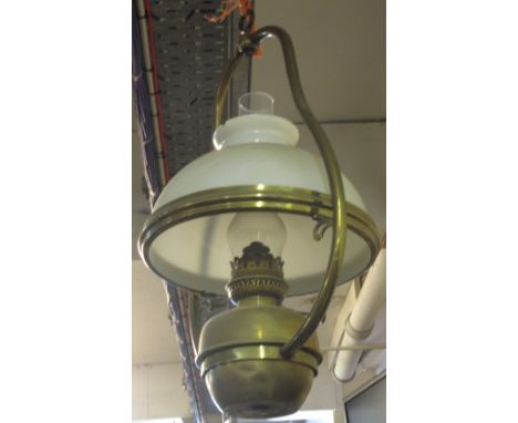 Brass hanging lamp oil burner with glass chimney and opaline glass shade.