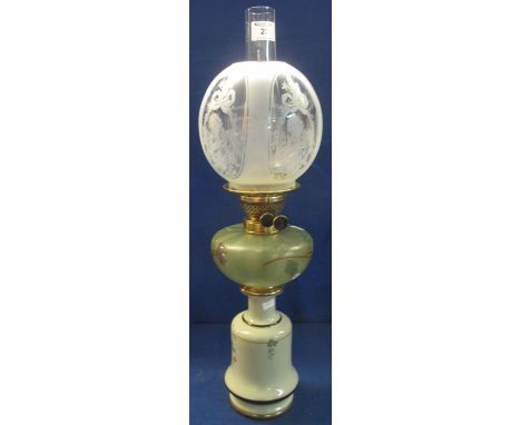 Early 20th Century brass double burner oil lamp with florally painted glass reservoir on a ceramic base with frosted glass sh