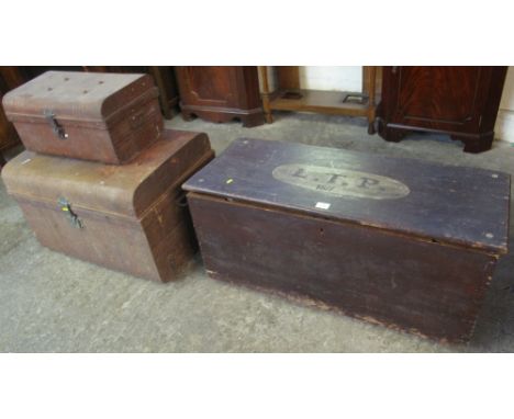 Stained rectangular pine trunk with initials: L.T.P., 1871, together with two similar metal, dome topped trunks. (3)