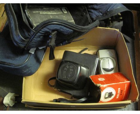 Zenith 35mm SLR camera and accessories, together with an Olympus compact 35mm film camera.