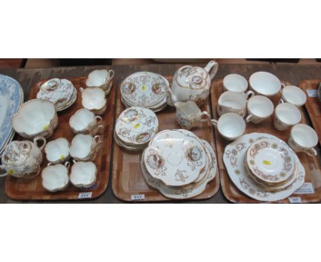 Two trays of Continental style, fluted porcelain tea set with gilt decoration and hand painted landscape panels comprising: t