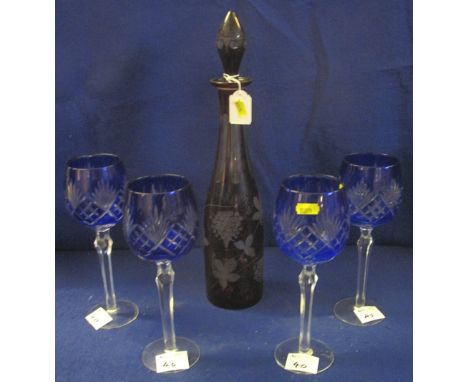 Set of four blue flash cut, lead crystal, hock glasses, together with a ruby flash cut, bottle shaped decanter and stopper. (