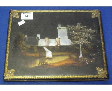 Late 19th/early 20th Century lacquered, hand painted and inlaid with mother-of-pearl castle design album cover, having gilt b