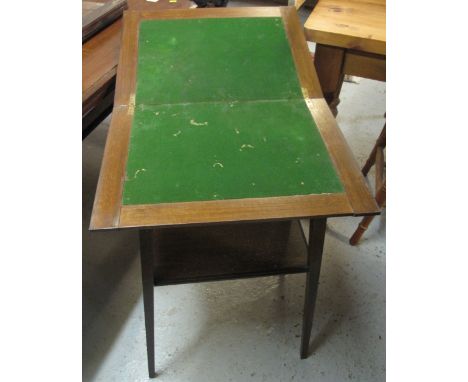 Early 20th Century oak two tier card table with hinged lid.