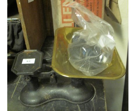 Set of cast metal kitchen type scales with brass pan and a set of cast metal weights.