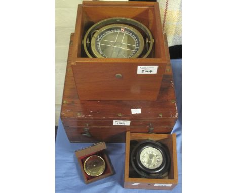 Cased navigation system by Martin; cased gimballed compass; another brass cased, gimballed compass type P11, no.: 33329H and 