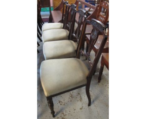 Set of four Edwardian mahogany upholstered dining chairs on ring turned legs. (4)