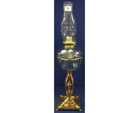Early 20th Century brass single burner oil lamp with fluted glass reservoir on a decorative brass, multi-stem, platform base,