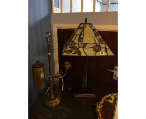 A heavy brass study lamp and a Tiffany style lamp