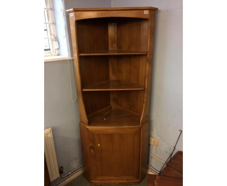 An Ercol Golden Dawn corner cabinet