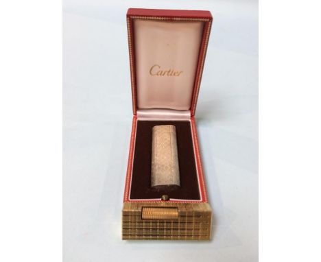 A boxed Cartier lighter, together with a gold plated Dunhill lighter