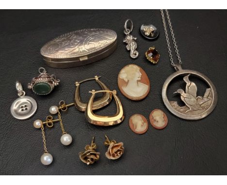 SELECTION OF JEWELLERY AND SILVERincluding three carved shell cameo sections, a Malcolm Gray for Ortak silver pendant of pier