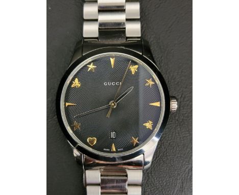 GUCCI G-TIMELESS WRISTWATCHthe circular textured black dial with arrow markers at 12,3,6,9 with interchanging star, bee and h