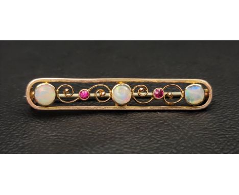 PRETTY OPAL AND RUBY NINE CARAT GOLD BAR BROOCHthe pierced brooch with scroll detail, 3.8cm wide 