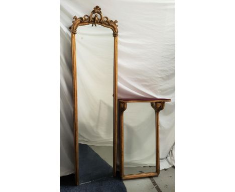 LATE 19th CENTURY PIER MIRRORwith a plain plate and carved giltwood frame surmounted with scrolls and a putti, the base with 