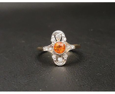 ART DECO STYLE FIRE OPAL AND DIAMOND PLAQUE RINGthe central round cut fire opal in a diamond set pierced and shaped surround,