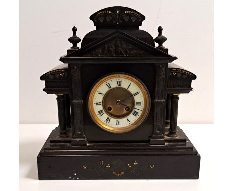 VICTORIAN BLACK SLATE MANTLE CLOCKof architectural outline with a circular brass and enamel dial with Roman numerals, with an