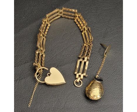 NINE CARAT GOLD THREE-BAR GATE BRACELETthe bracelet with a heart padlock and safety chain, approximately 10.4 grams; together