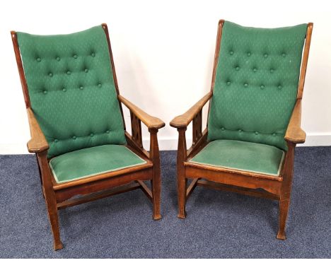 PAIR OF ARTS AND CRAFTS WALNUT ARMCHAIRSwith button backs, padded seats, shaped arms and pierced side slats, standing on shap