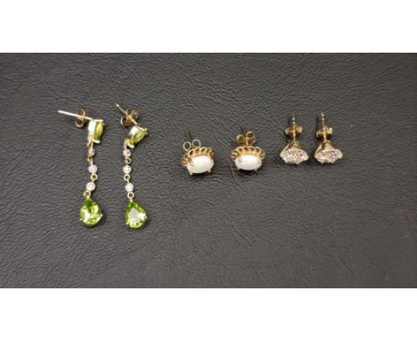 THREE PAIRS OF GEM AND STONE SET EARRINGScomprising a pair of peridot and diamond drop earrings in fourteen carat gold; a pai