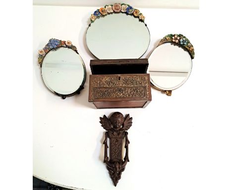 THREE BARBOLA MIRRORSa relief decorated metal jewellery box and a cast iron door knocker surmounted with cherub 