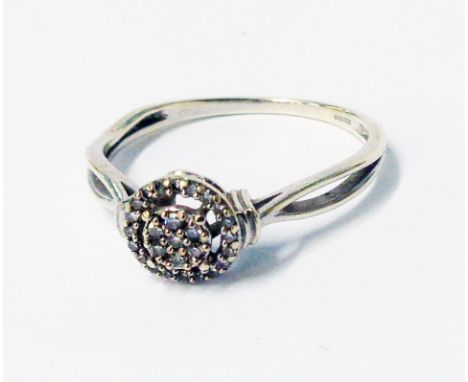 A marked 375 white metal tiny diamond cluster ring - boxed