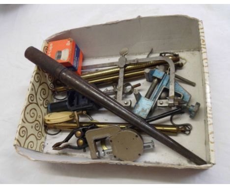 A box containing assorted jeweller's tools