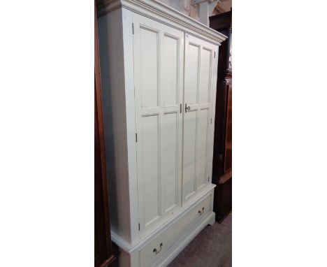 A 1.30m Laura Ashley painted wood double wardrobe with moulded cornice and hanging space enclosed by a pair of panelled doors