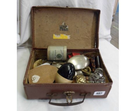 A small suitcase containing assorted items including lighters, snuff box, etc.