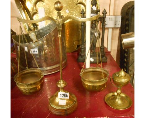 A set of brass balance scales and a gimbal oil lamp