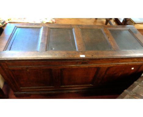 A 1.53m 18th Century oak coffer with four fielded panels to lid and three to front and back, original iron loop hinges - lock
