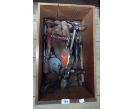 A drawer containing assorted tools including brace and bit, adjustable spanners, etc.