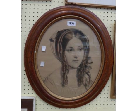 A polished oak framed tinted stipple engraving portrait of a young lady wearing a bonnet